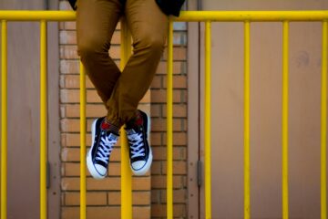 Age range student on railing
